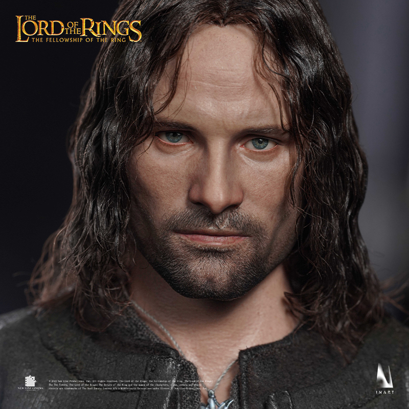 Miniature Aragorn figure, capturing his heroic stance.