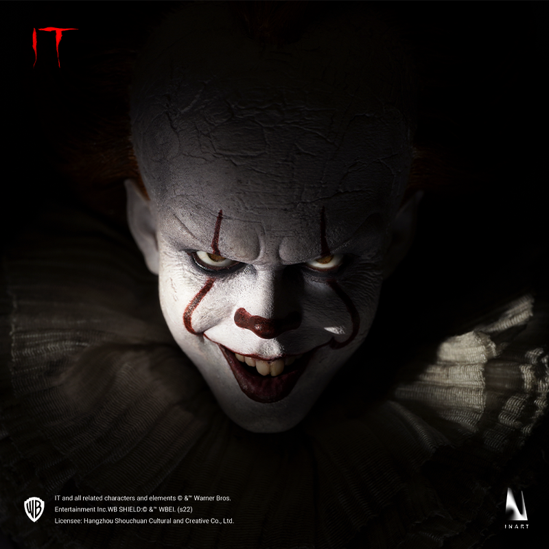 Pennywise figurine with lifelike facial features and menacing gaze