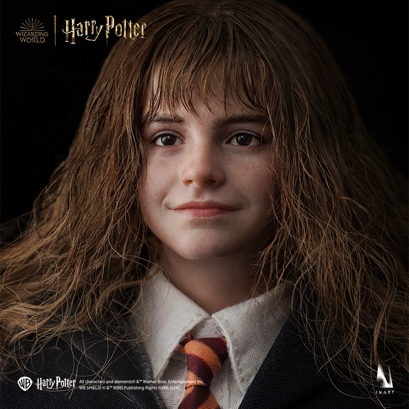 Miniature statue of Hermione Granger with Gryffindor robes