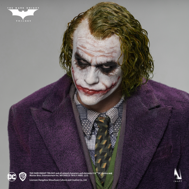 Miniature statue of The Joker with a sinister grin