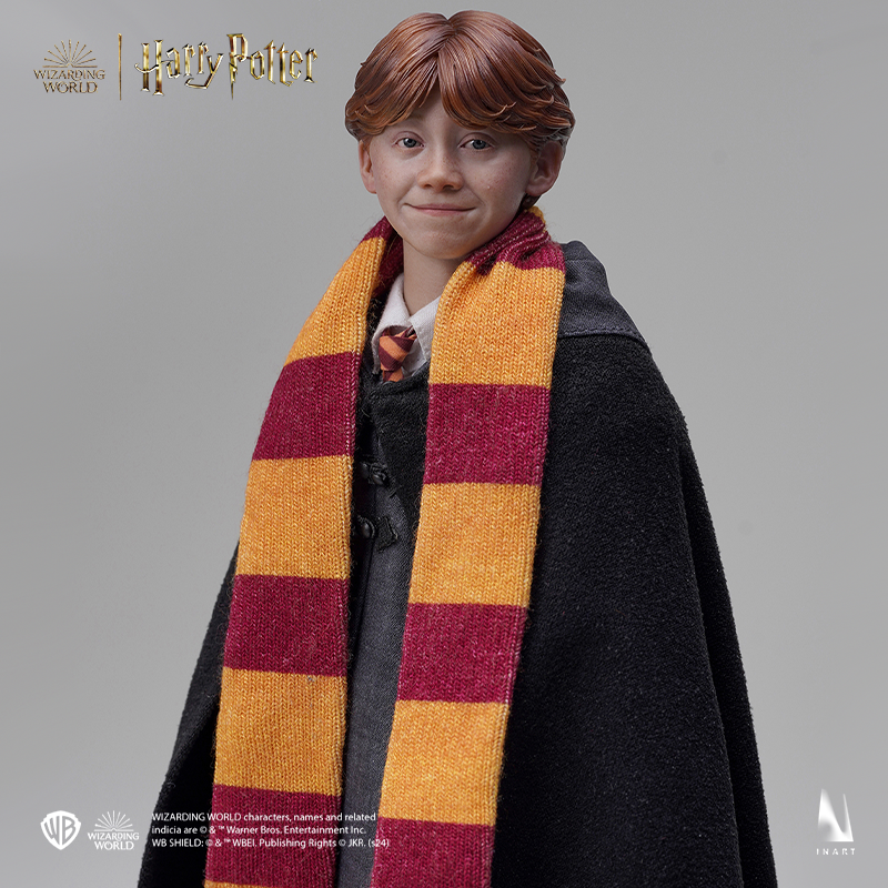 Miniature Ron Weasley with authentic Hogwarts robes and wand