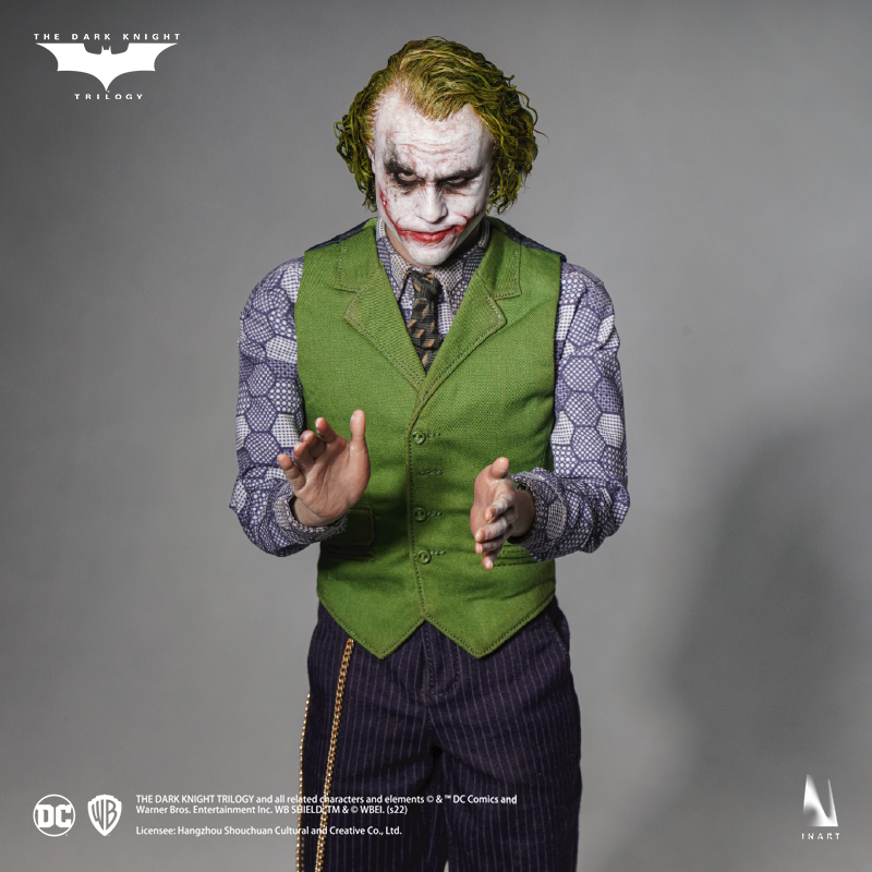 The Joker figure standing with characteristic psychotic determination