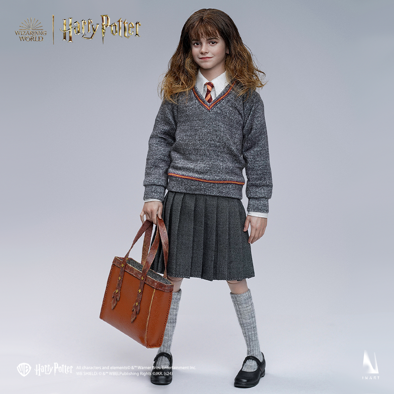 Hermione Granger figure with authentic Hogwarts uniform and wand